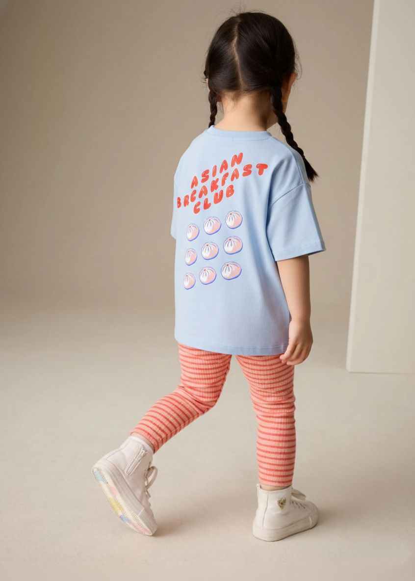 Girl wearing blue kids t-shirt with asian breakfast club and buns print